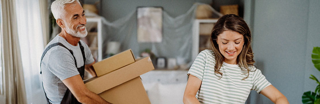 Young woman moving to a new home.