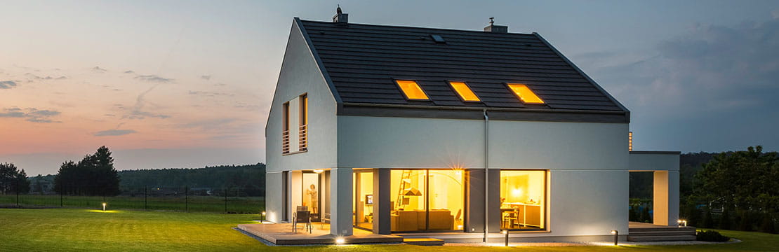 modern house with outdoor and indoor lighting, at night